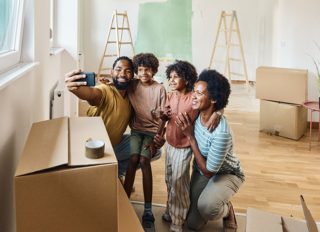 Family taking a selfie in their new home