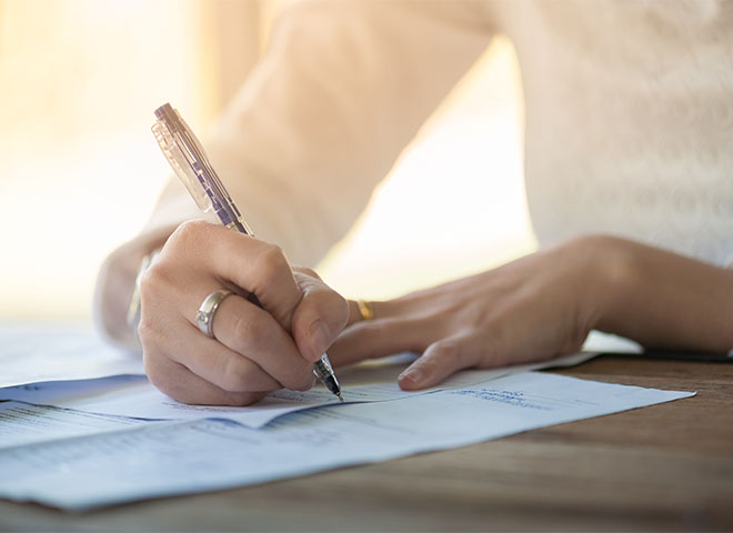 Woman writing on a form