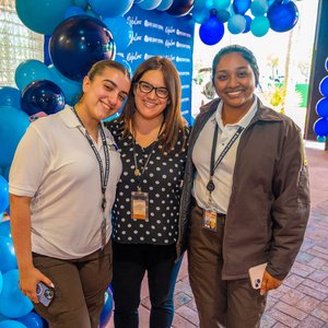 Three women smiling at camera