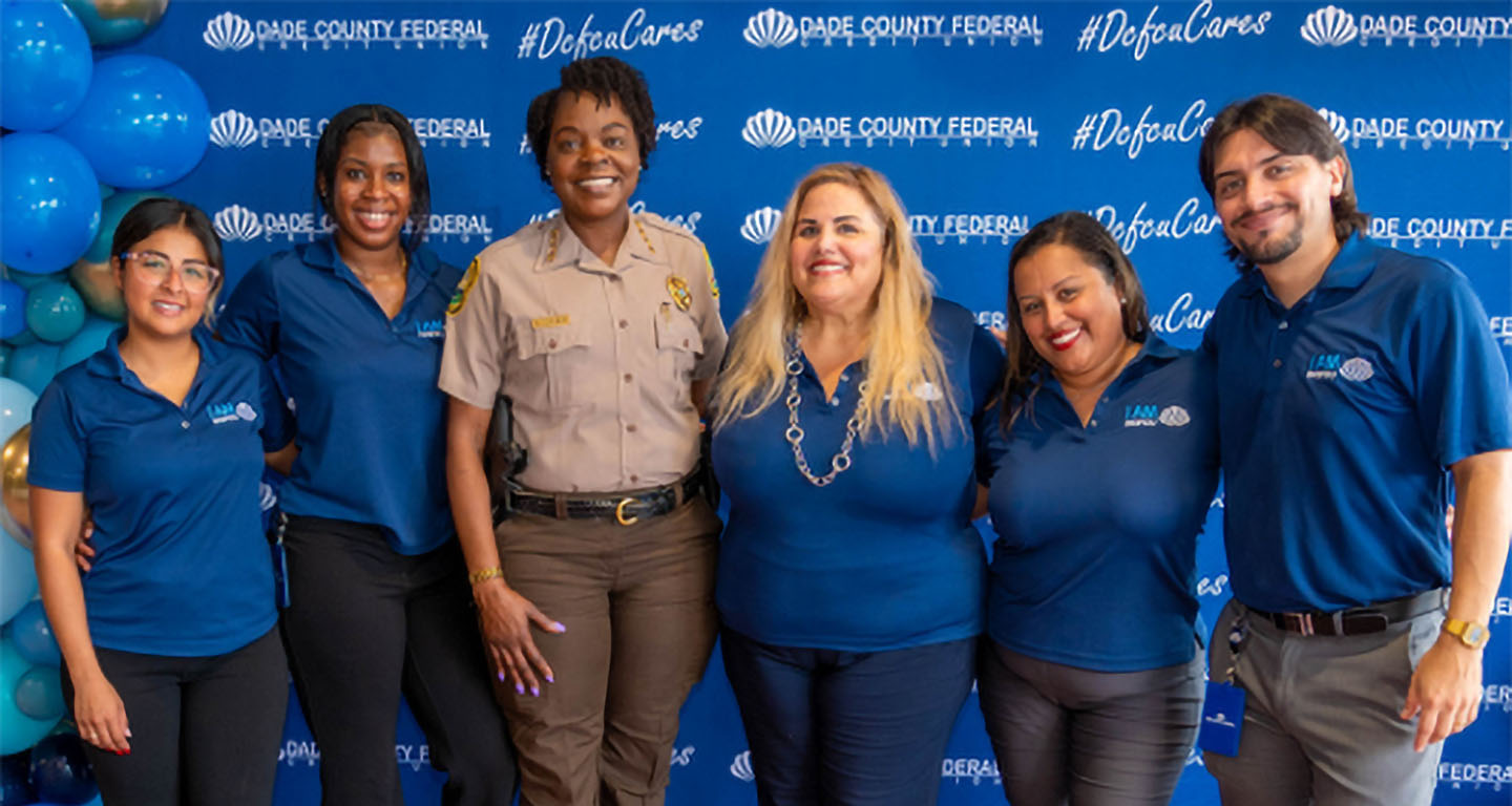 Five representatives of DCFCU with Miami-Dade County Police officer