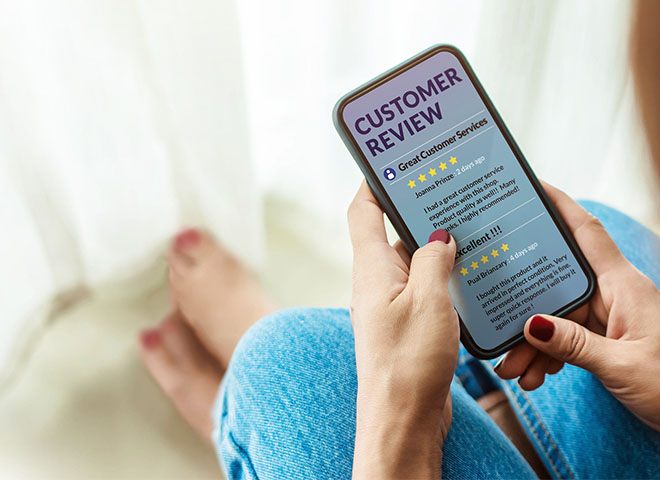 Woman leaving a review on smartphone