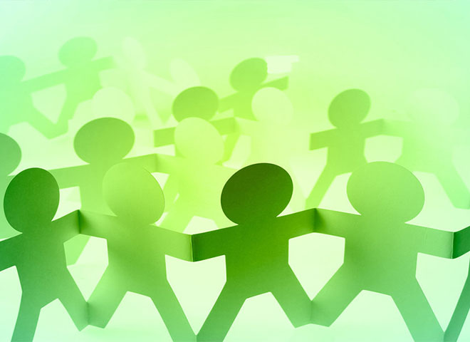 Green paper cut-outs of people figures
